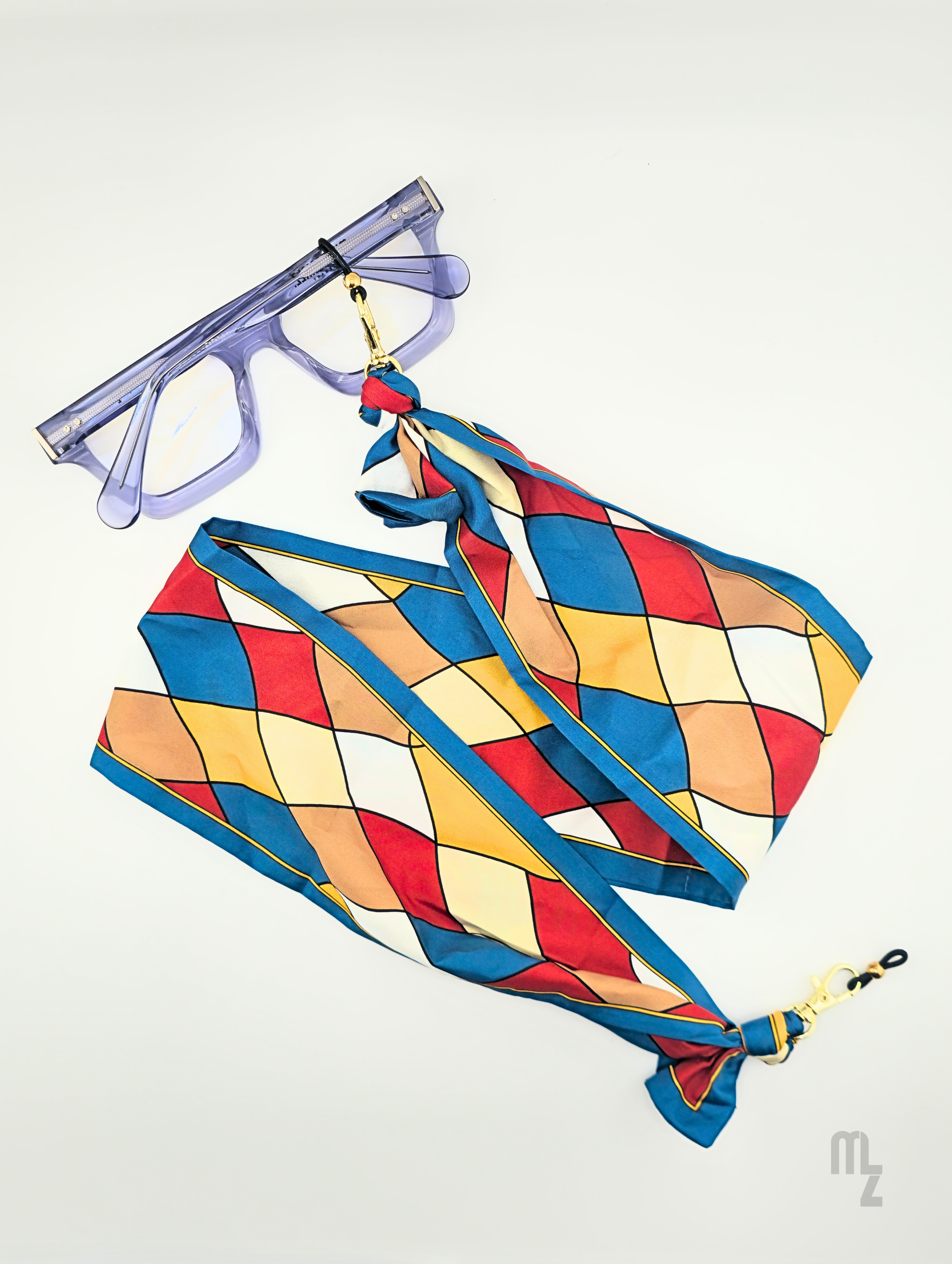 Arlecchino Silk – Luxuriöse Brillenkette mit farbiger Seidenstruktur.