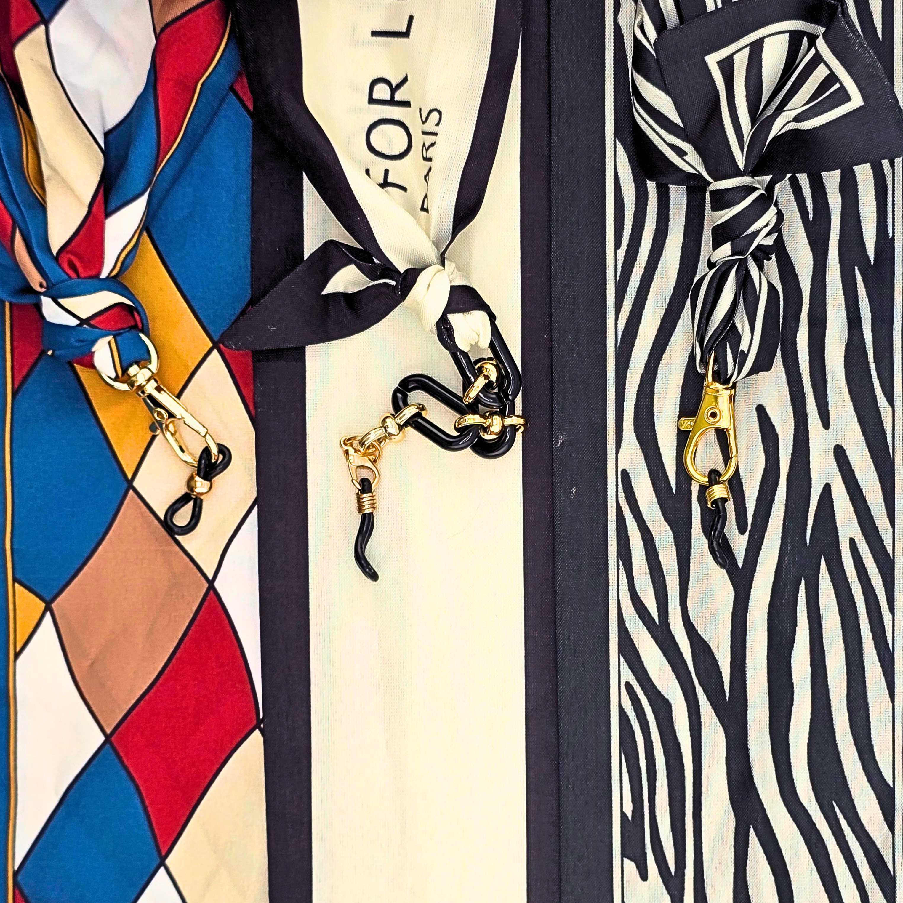 Luxuriöse Brillenbänder und Seidentücher – dreifach Set mit Arlecchino Silk, Parisian Silk und Savannah Silk.